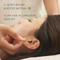 A close-up of a person lying down while another hand applies clear, square ear cuppressors near the ear. Text on the image reads, 'A QUIET RITUAL, ROOTED WITHIN.